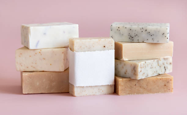 istock Beige and brown handmade soap bars on light pink close up, soap packaging mockup 1757796978