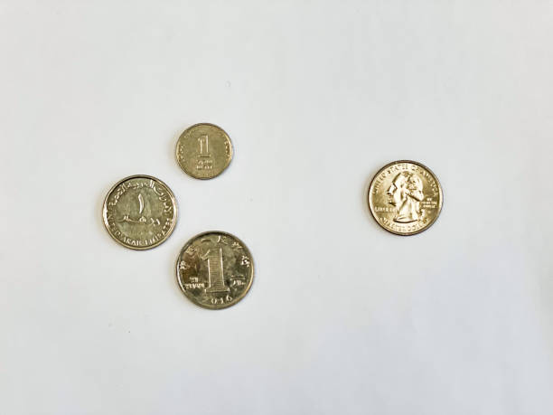 istock US quarter dollar vs 1 dirham, 1 shekel, 1 yuan coins 1757797532