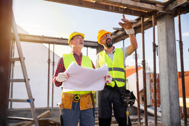 istock Caucasian architect and building contractor having an meeting about project on a construction site 1757800479