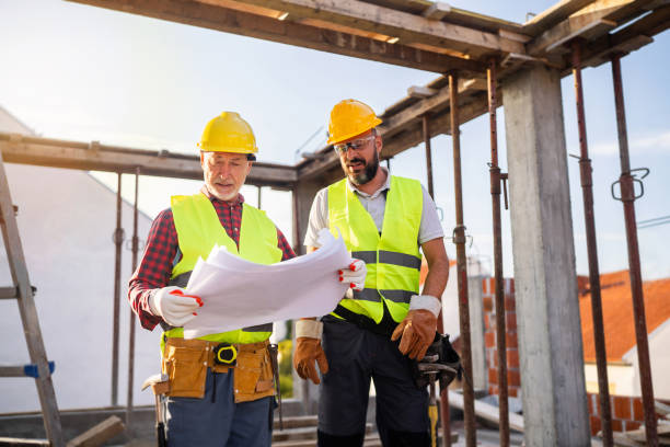 istock Caucasian architect and building contractor having an meeting about project on a construction site 1757800482