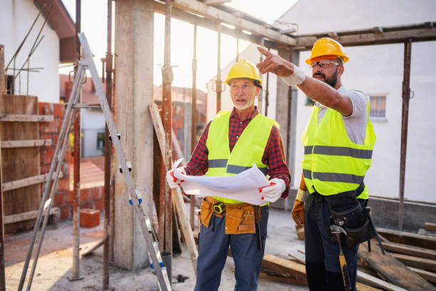 istock Caucasian architect and building contractor having an meeting about project on a construction site 1757800483