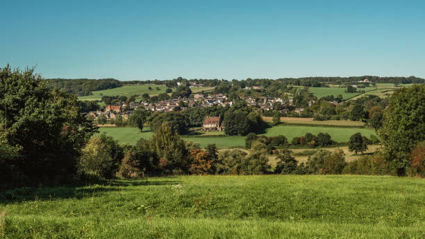 istock Lush hilly countryside with village on hillside under a blue sky during summer. 1757801594
