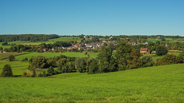 istock Lush hilly countryside with village on hillside under a blue sky during summer. 1757801597
