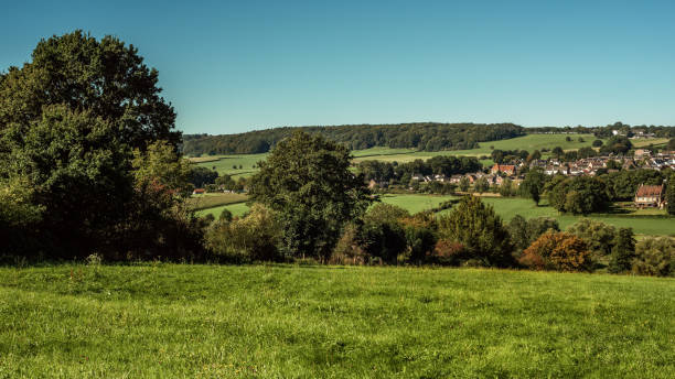 istock Lush hilly countryside with village on hillside under a blue sky during summer. 1757801616