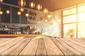 Empty wooden table space platform and blurred resturant or coffee shop background for product display montage