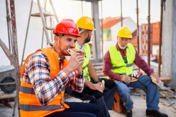 istock Male Caucasian construction workers having an lunch break on a construction site 1757809865