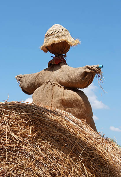 istock Scarecrow sitting on a pile of straw. 175781155