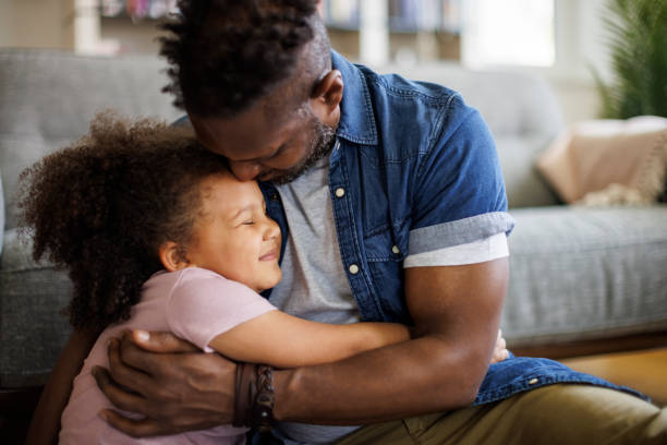 istock Father and daughter embracing at home 1757822574