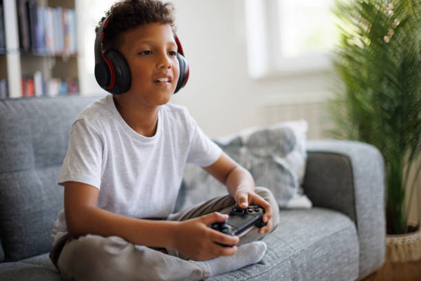 istock African-American boy playing video games online 1757822577