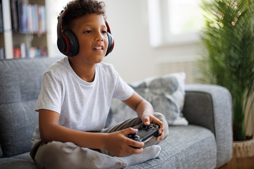 African-American boy playing video games online