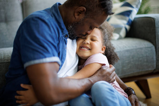 istock Father and daughter embracing at home 1757822585