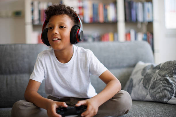 istock African-American boy playing video games online 1757822620