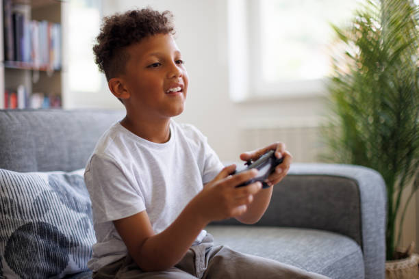 istock African-American boy playing video games online 1757822652