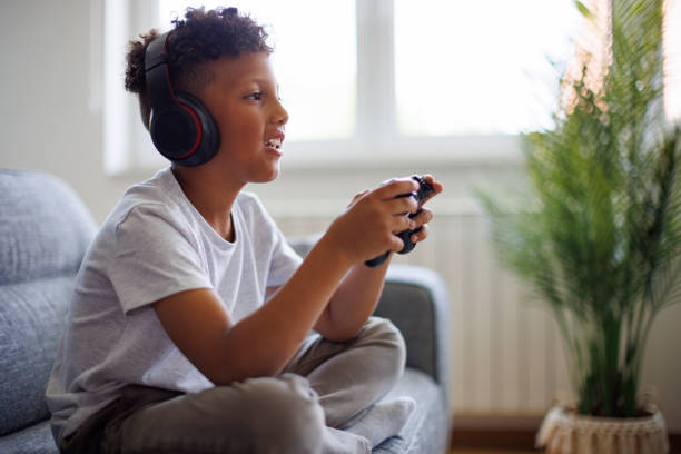 istock African-American boy playing video games online 1757822689