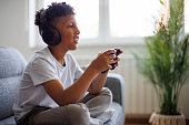 African-American boy playing video games online