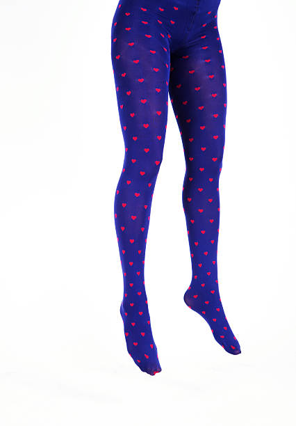 istock Women's legs in brightly coloured tights against a white background 175782970