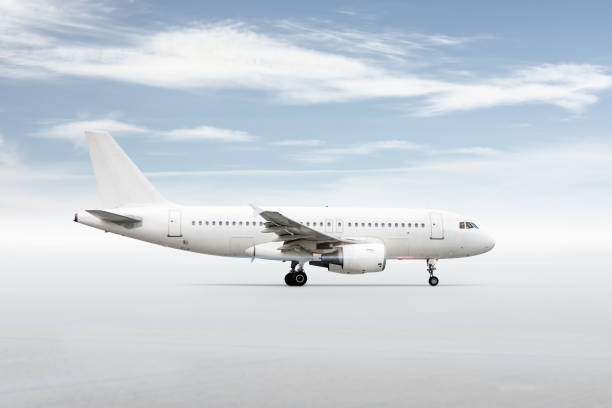 istock White passenger jetliner isolated on bright background with sky 1757844518