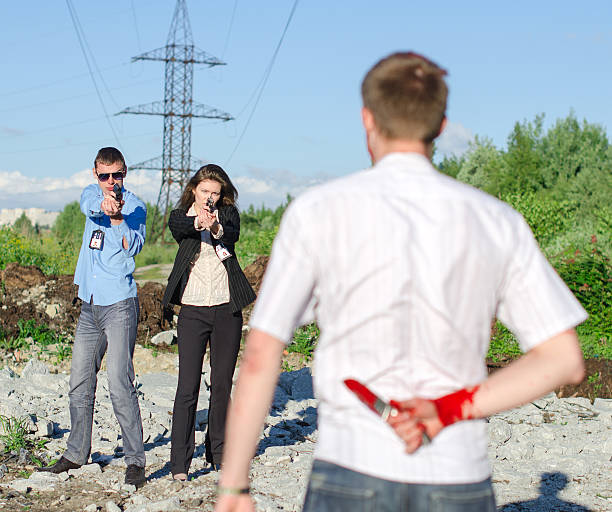 istock Two FBI agents arresting an offender with knife 175786181
