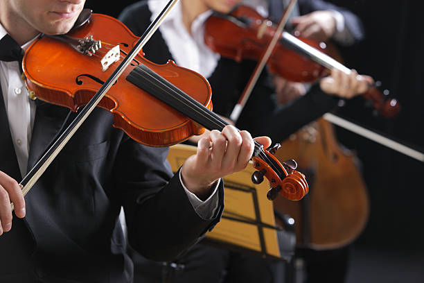 istock Violinists playing in concert playing classical music 175786434