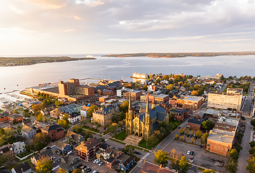 Aerial drone photograph of downtown Charlottetown looking towards the ocean at sunrise