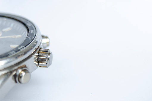 Expensive wristwatch in a black box, isolated on white background.