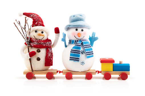 Wooden colorful toy train with two snowmen isolated on white background