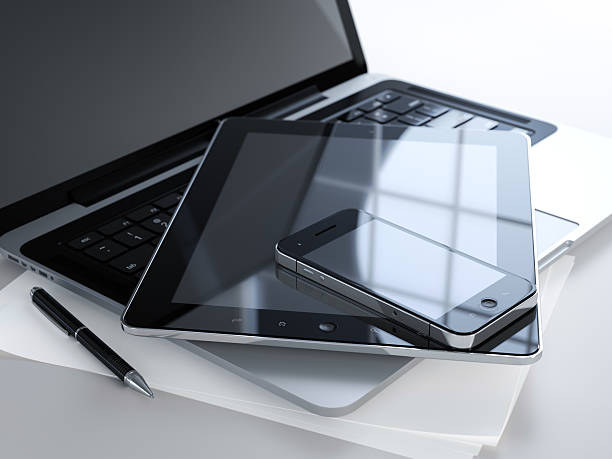 3D illustration of office table with electronic devices and blank sheet of paper