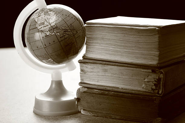 istock Pile of old books and globe 175788447