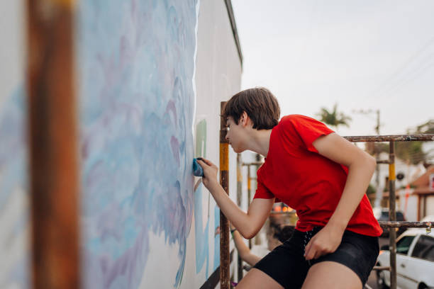 istock Boy doing street art on a wall 1757915776