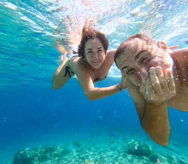istock Funny couple at the underwater fun. 1757920912