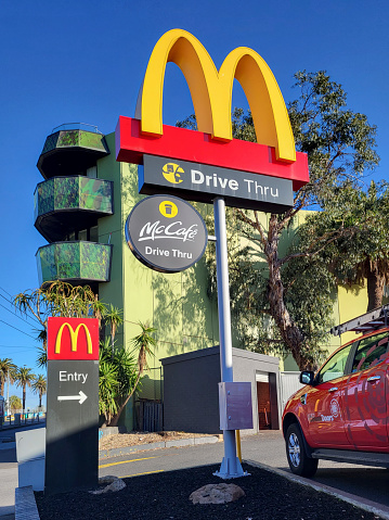 Melbourne, Australia: July 19th, 2022: Sign and entrance to a McDonald's drive through order and pay station. McDonald's is an American fast food restaurant chain.