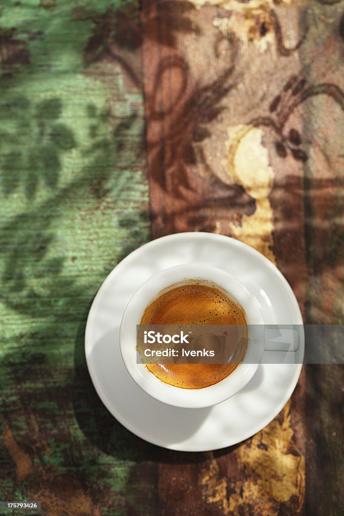 espresso coffee cup on rustic table with sun Black Coffee Stock Photo