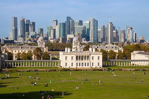 Beautiful cityscape with Canary Wharf skyscrapers background at Greenwich Park in Greenwich, the UK