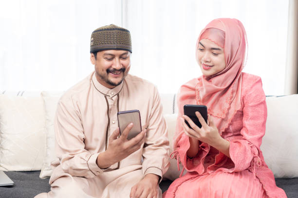 istock happy couple using smartphone or digital tablet and credit card at home 1757947573