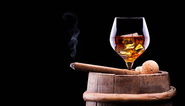 istock Cognac and Cigar on black with vintage barrel 175795349