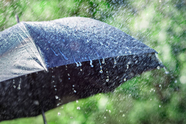 istock Rain on umbrella background, weather forecast and environment concept 1757967583