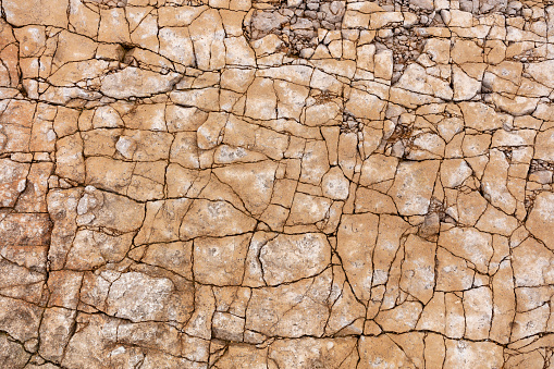 Cracked rock stone surface shattered textured background