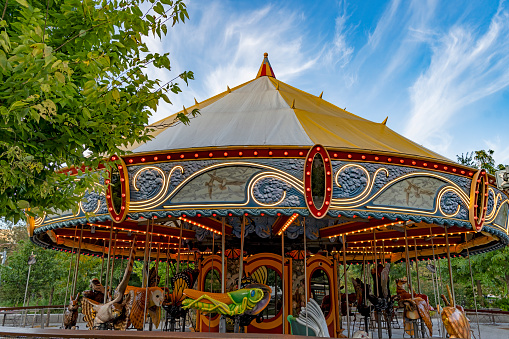 Kiddie Carousel ride for kids in the park. during sunset