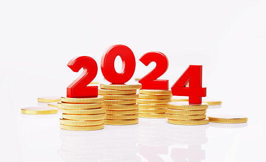 2024 numbers sitting over coin stacks. Horizontal composition with copy space. 2024 business plan and financial goals concept.