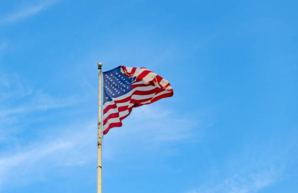 istock United States flag on a flagpole at dusk 1757971980
