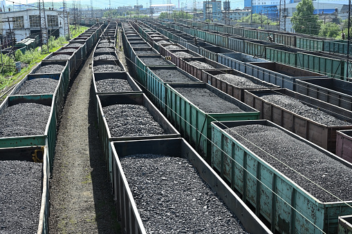 Long trains of railroad wagons full of coal