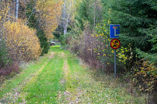 Road signs at small narrow forest road Kumla Sweden October 20 2023