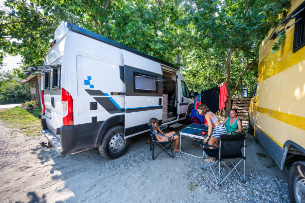 istock Family having coffee in a parked camper van on campsite. 1757997685