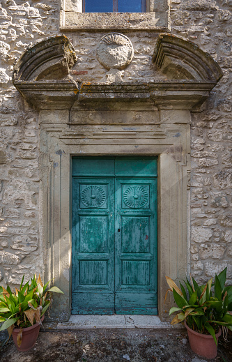 old door in in a traditional tuscan stone house, Italy