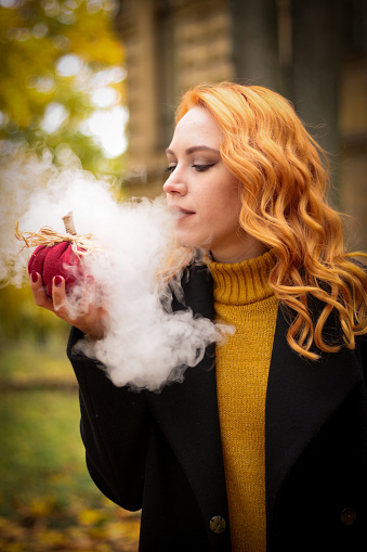 Woman holding marijuana joint