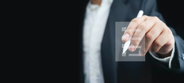 istock Customer evaluation feedback. Businessman holding and showing the best quality assurance with golden five stars for guarantee product and ISO service concept.satisfaction ,giving a five star rating. 1758028105