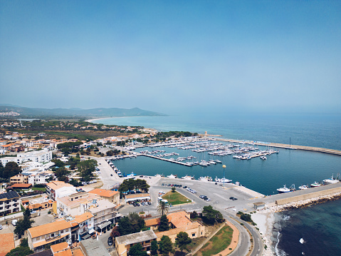 La Caletta on the east coast of Sardinia, Italy. Aerial panorama view to the harbour port during summer.