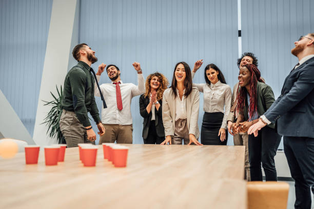 istock Young colleagues playing beer pong 1758057646