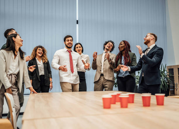 istock Young colleagues playing beer pong 1758061014