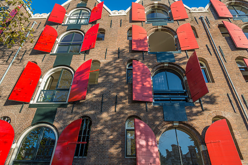 Window exterior shutters on Amsterdam brick facade house